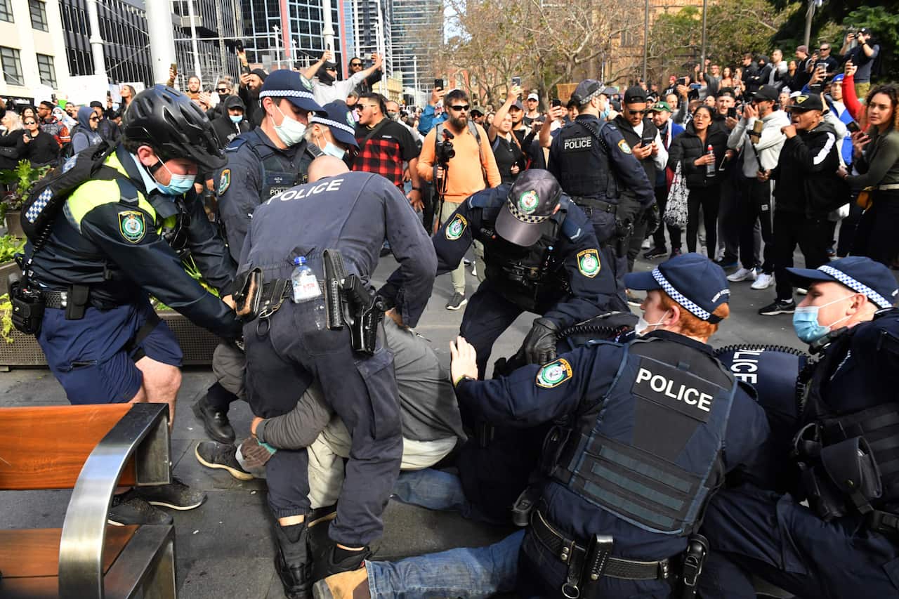 Protesters are arrested by the police at Sydney Town Hall during the ‘World Wide Rally For Freedom’ anti-lockdown rally at Hyde Park in Sydney, 24 July, 2021. 