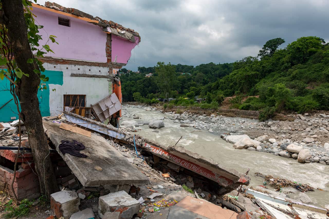 A shop is completely damaged due to flash floods caused by heavy rains in the past few days in Dharmsala, India
