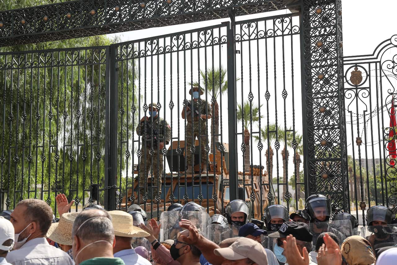 Tunisian military forces guard the area around the parliament building in the capital Tunis 26 July 2021. 