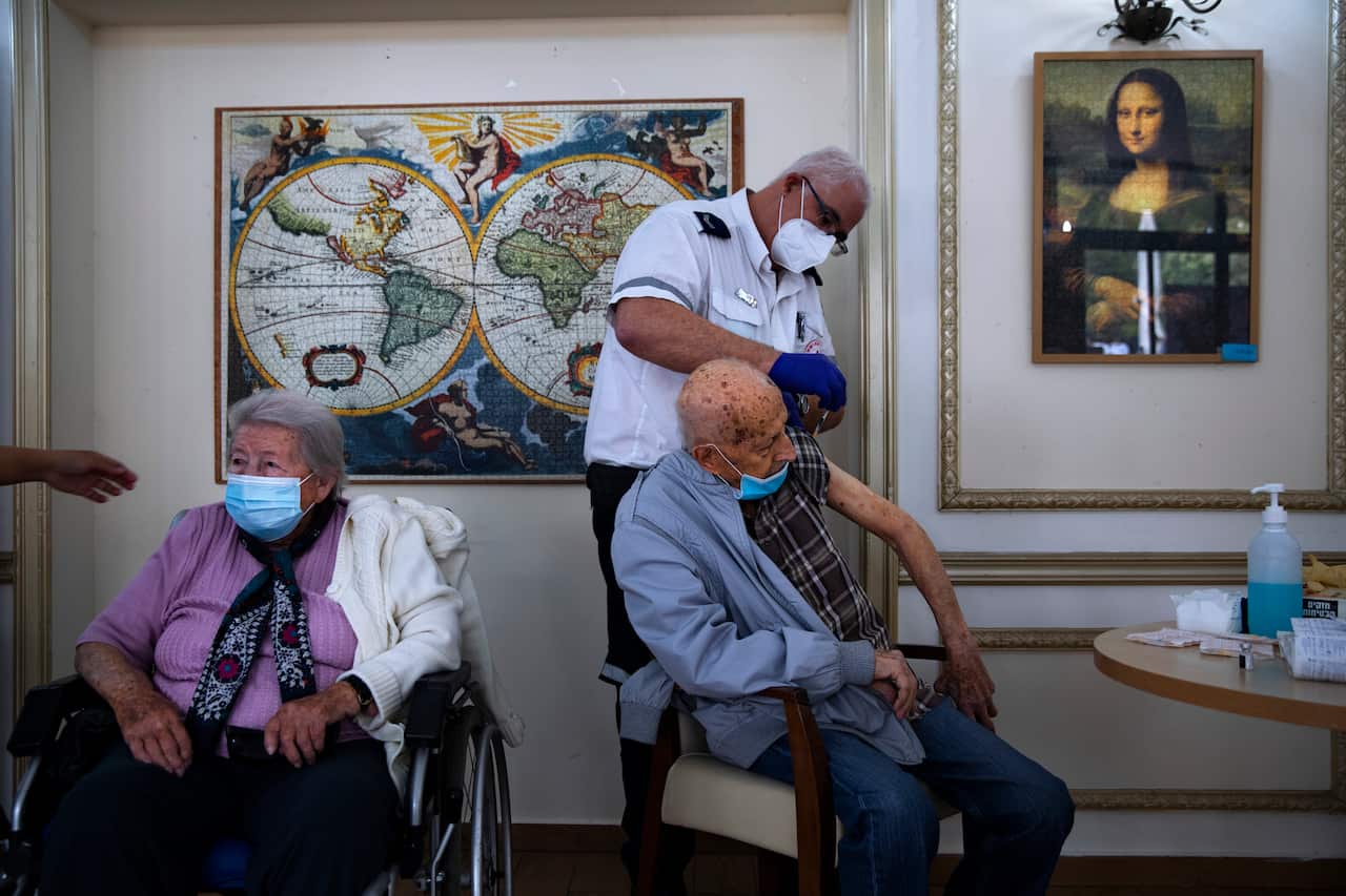 An elderly man receives COVID-19 vaccine at a private nursing home, in Ramat Gan, Israel.