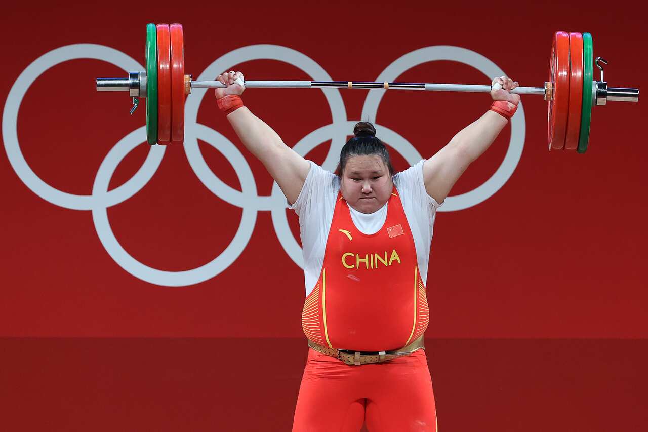China's Wenwen Li competes in the women's +87kg group A final weightlifting event during the 2020 Summer Olympic Games. 