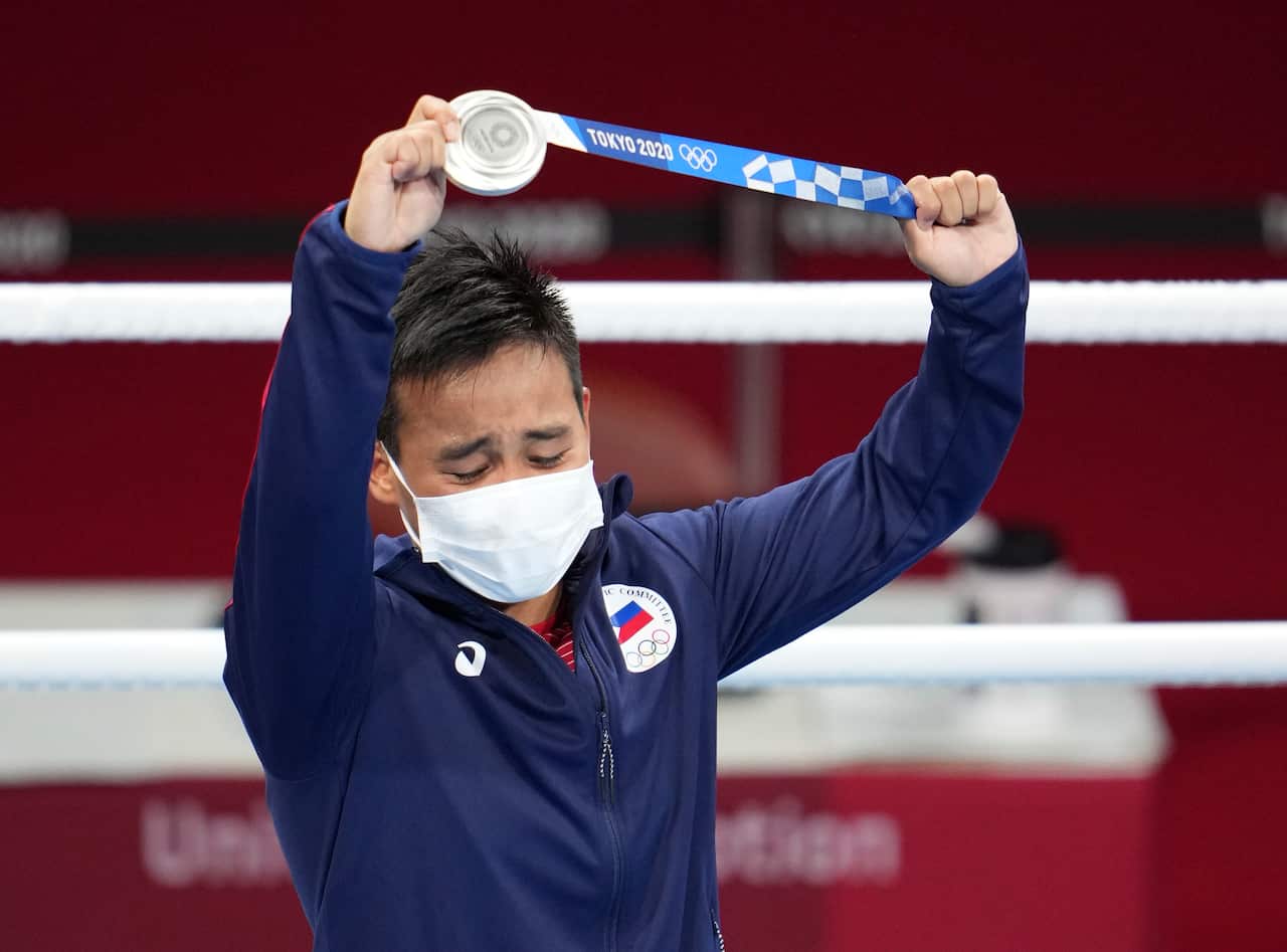 Nesthy Petecio attends a victory ceremony after placing 2nd at the Tokyo Olympic Games