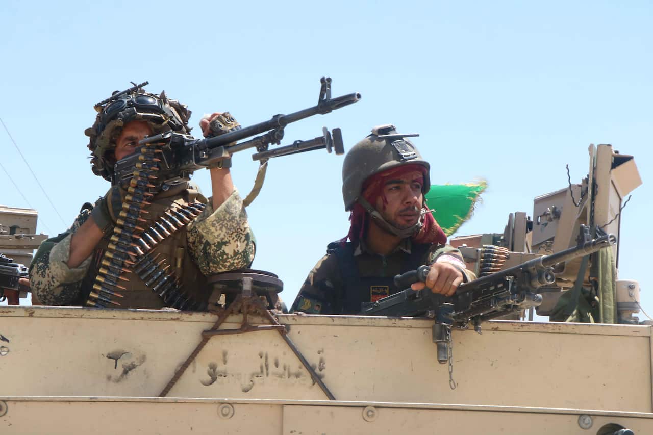 Afghan security officials patrol after they took back control of parts of Herat city following intense battle with Taliban militants on 5 August, 2021.