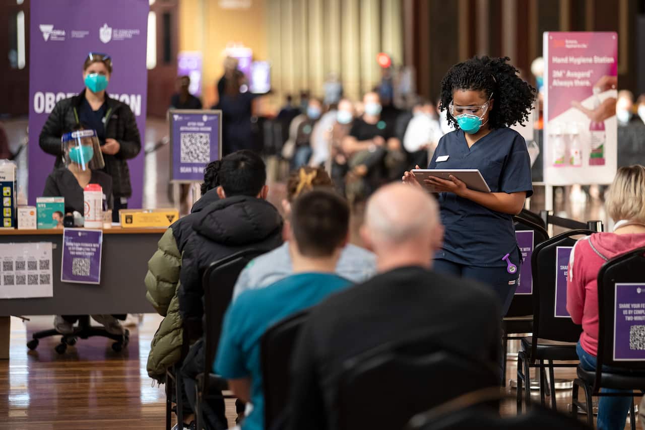 Health staff at a COVID-19 vaccination site at the Royal Exhibition Building in Melbourne, Tuesday, 10 August, 2021.