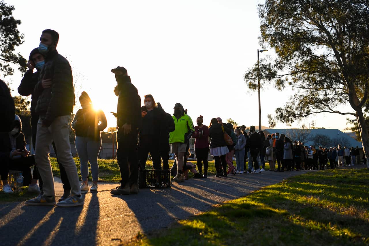 People cue in long lines outside a walk-in COVID19 testing clinic in Weston Creek, Canberra, Thursday, 12 August, 2021.