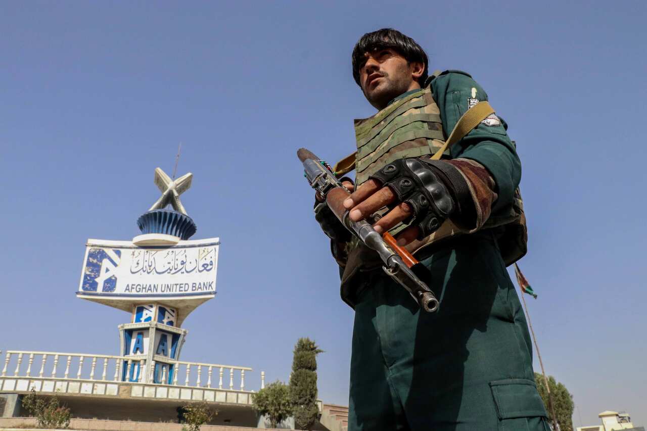 An Afghan security official checks vehicles at a check point in Kandahar, Afghanistan, 12 August 2021.