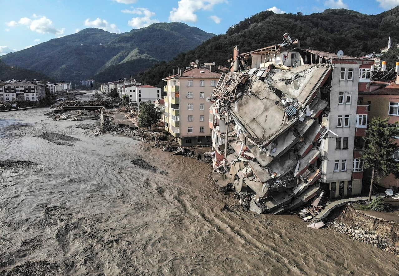 An aerial photo shows destroyed buildings after floods and mudslides in Bozkurt, Kastamonu province, Friday, Aug. 13, 2021. 