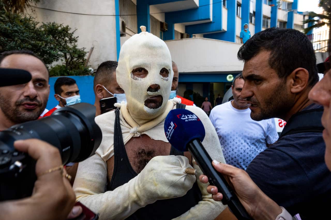 A burnt soldier leaves the As-Salam hospital in Tripoli, after he was wounded in a fuel tank explosion in Tiel
