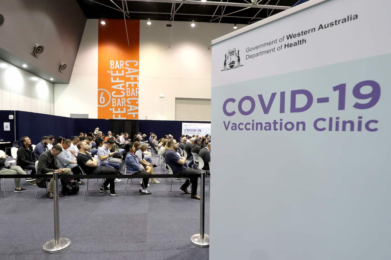 People waiting to receive their COVID-19 vaccination at a mass clinic in Perth