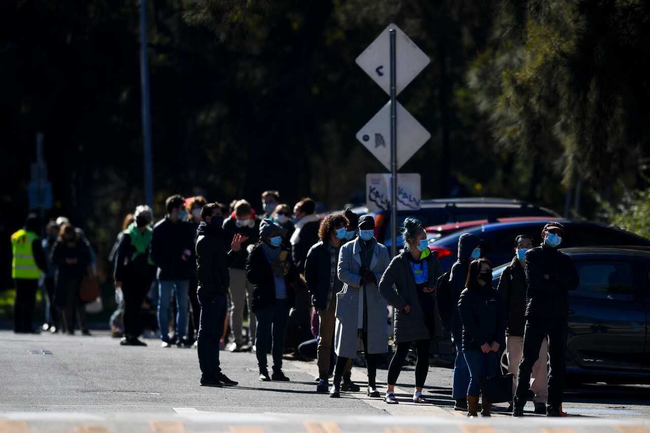 People cue outside a walk-in COVID19 testing clinic in OConnor, Canberra, Wednesday, 18 August, 2021.