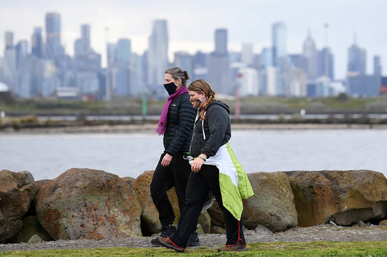 People wearing face masks are seen in Melbourne, Sunday, August 29, 2021. Victoria has recorded 92 new cases of locally acquired Covid19 in the past 24 hours. (AAP Image/James Ross) NO ARCHIVING