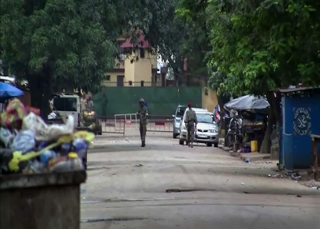 In this image made from video, unidentified soldiers are seen near the presidential palace in the capital Conakry, Guinea Sunday, 5 September, 2021. 