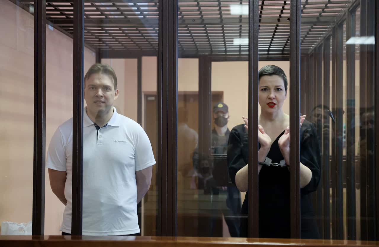 Belarusian opposition activists Maxim Znak (L) and Maria Kolesnikova appear for a sentencing hearing at the Minsk Region Court. 