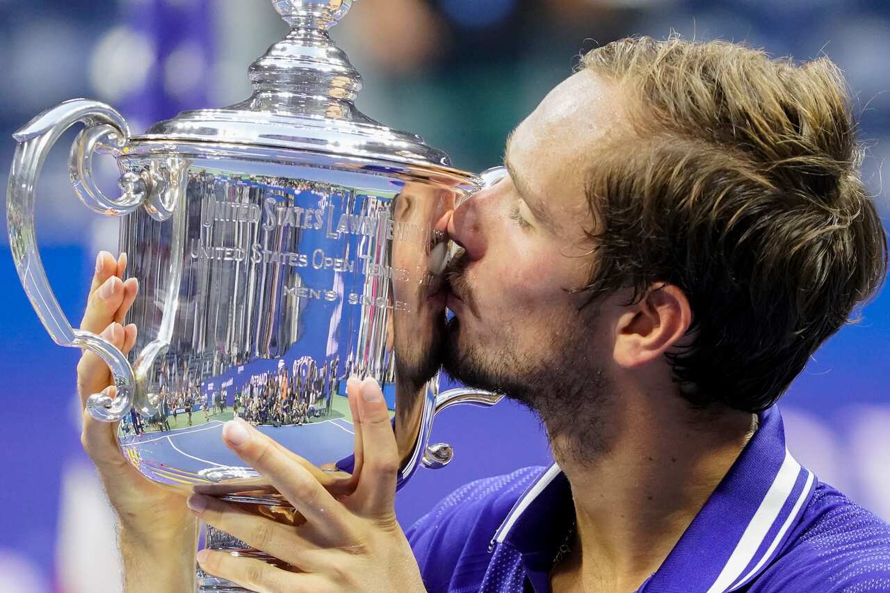 Daniil Medvedev, of Russia, kisses the championship trophy after defeating Novak Djokovic, of Serbia, in the men's singles final of the US Open.