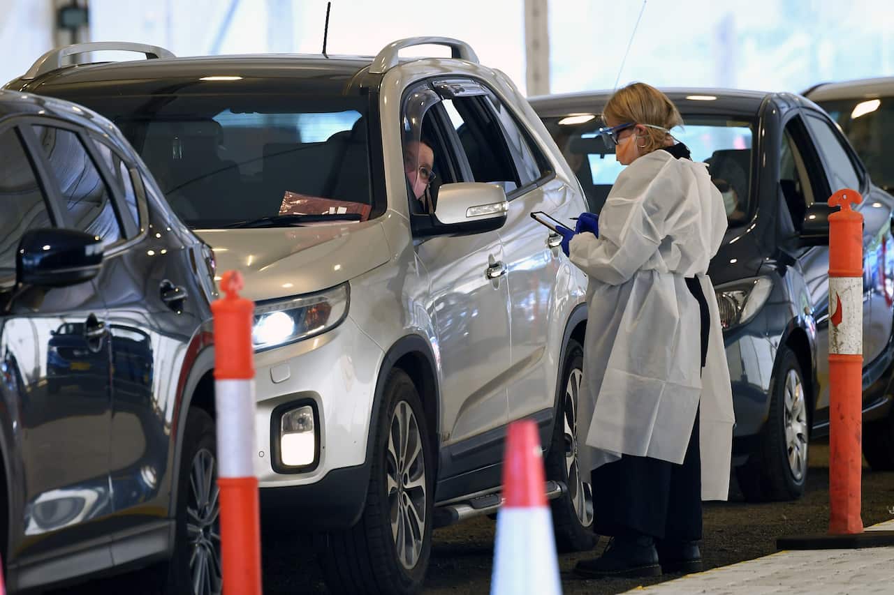 Healthcare workers are seen at a Covid19 testing facility in Ballarat,