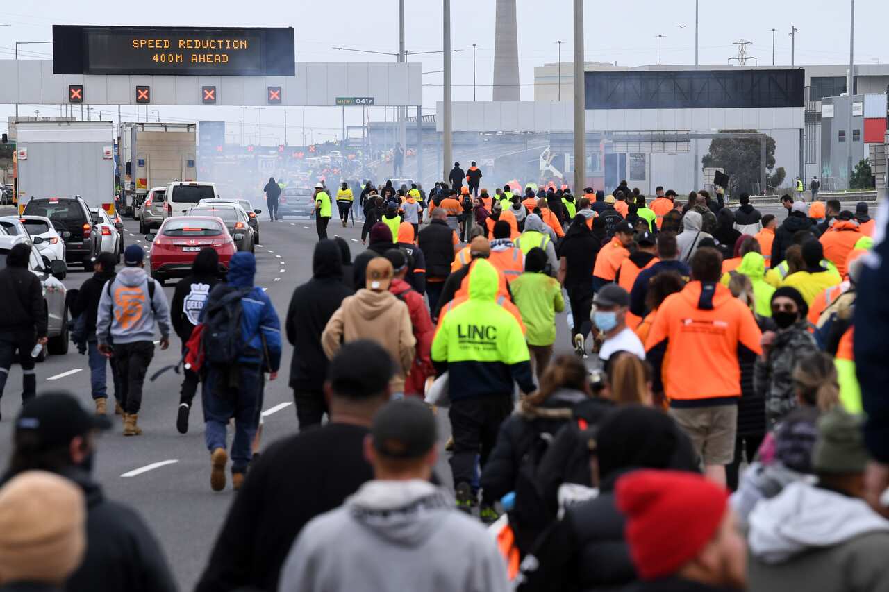 Protesters are seen on the West Gate Freeway in Melbourne, Tuesday, 21 September, 2021. 