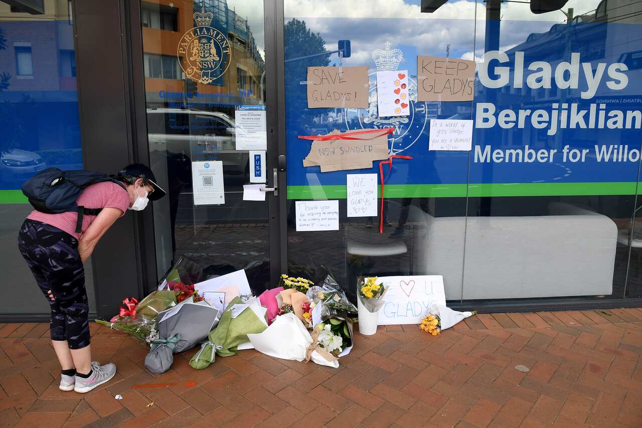 Messages and flowers are seen outside the electoral office of Gladys Berejiklian, in Sydney.