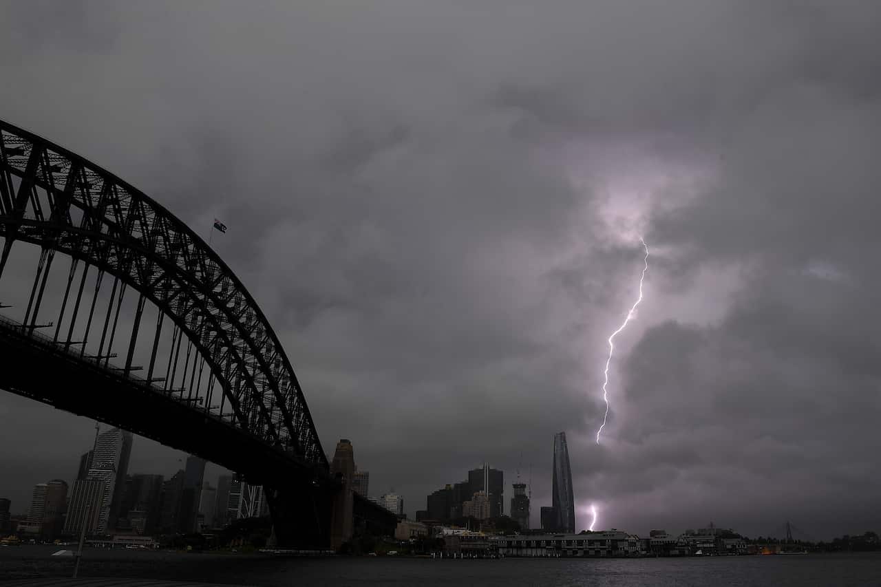 Storm clouds and lightning are seen in Sydney, Thursday, October 14, 2021. (AAP Image/Dan Himbrechts) NO ARCHIVING