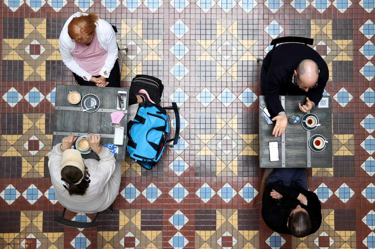 People at cafes inside Sydney's Strand Arcade 