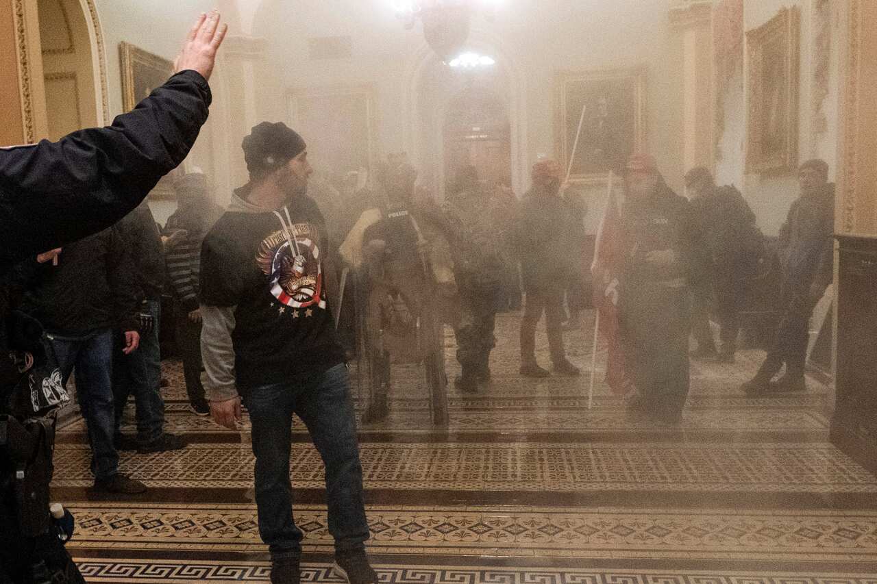 A man with a QAnon jumper during the 6 January 2021 Capitol riot