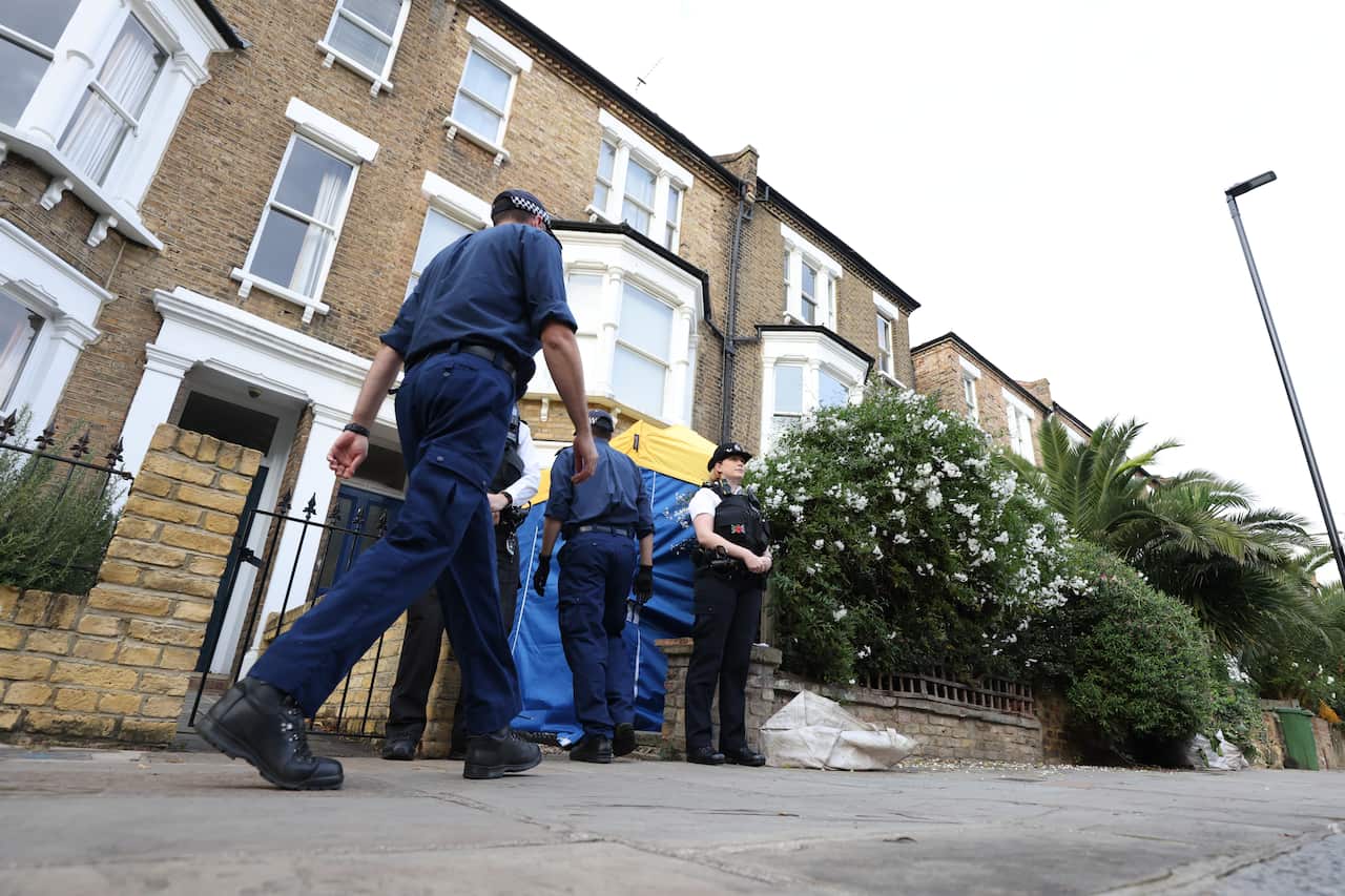 Police officers outside a house in north London, thought to be linked to the suspected killer of Conservative MP Sir David Amess