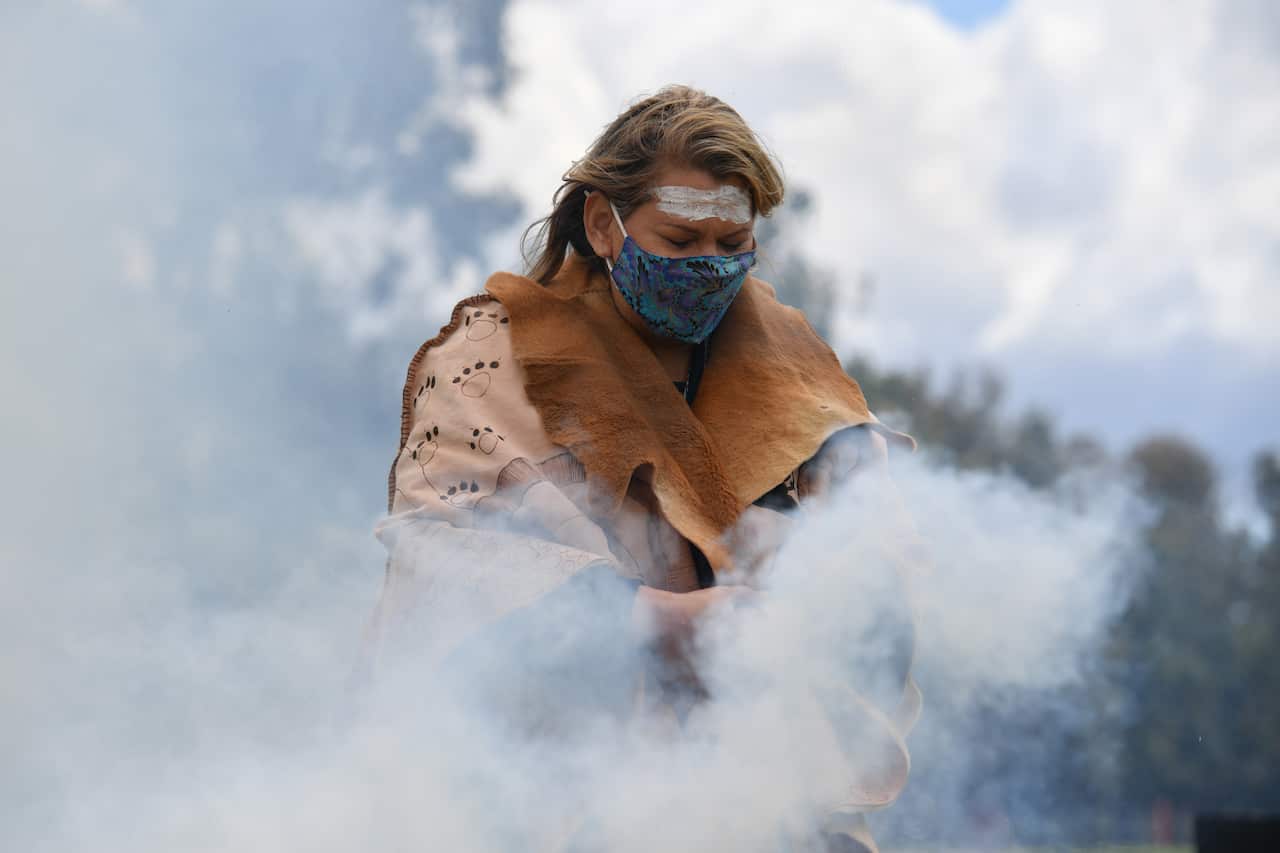 Greens Senator Dorinda Cox at an Indigenous smoking ceremony at the Aboriginal Tent Embassy outside Old Parliament House in Canberra.