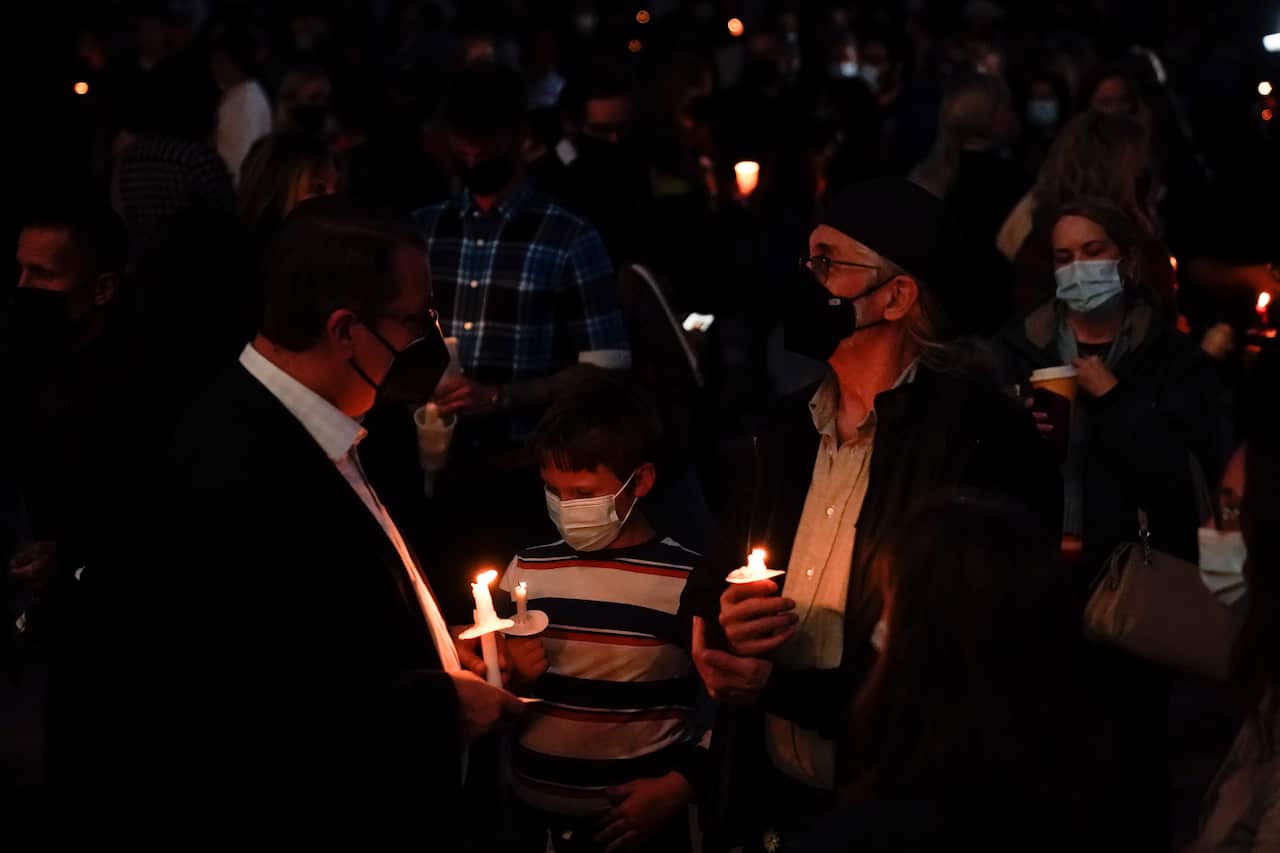People attend a candlelight vigil to honor cinematographer Halyna Hutchins in Albuquerque, Saturday, 23 October, 2021.