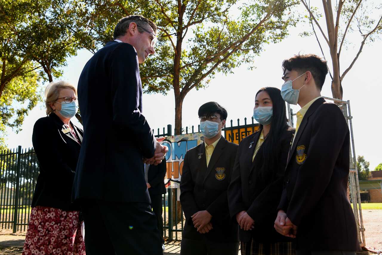 NSW Premier Dominic Perrottet meets with Year 12 students from Fairvale High School before a press conference at Avery Park in Sydney, Monday, October 25, 2021.