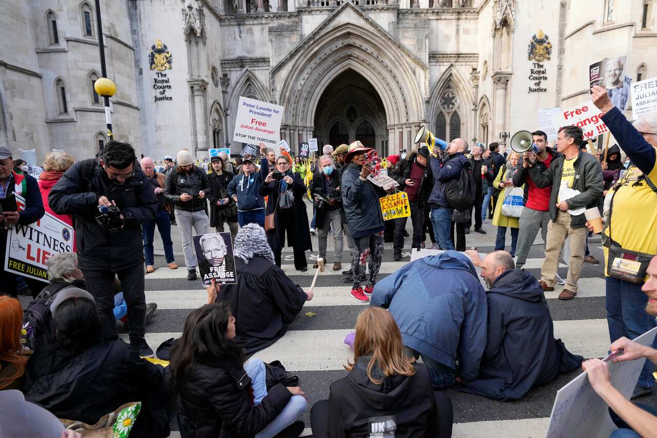 Protestors block a road outside the High Court in London, Thursday, 28 October, 2021. 