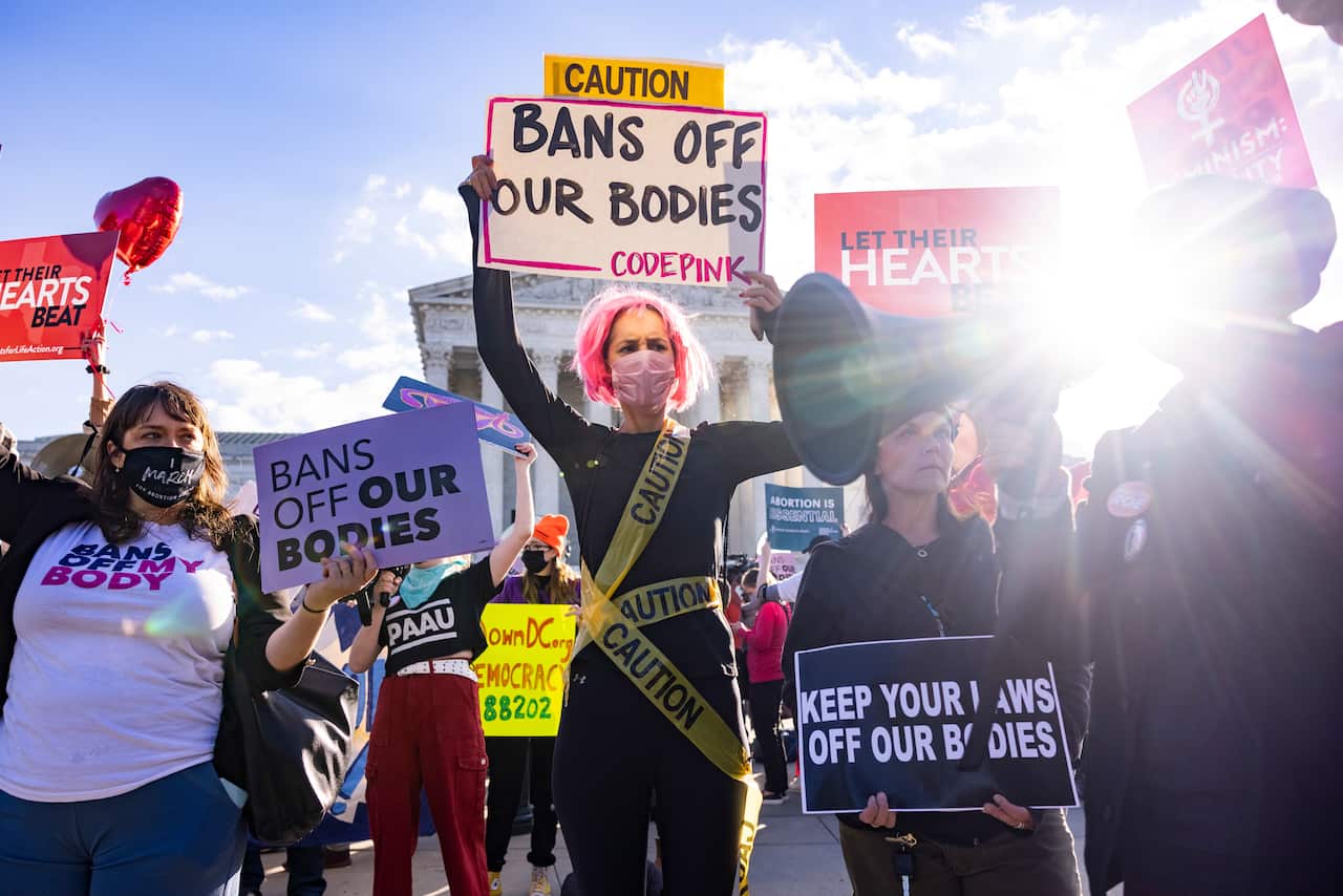 epa09557659 Pro-choice protestors gather outside the US Supreme Court as the high court hears arguments in two challenges to a Texas law that bans most abortions in Washington, DC, USA, 01 November 2021.  EPA/JIM LO SCALZO