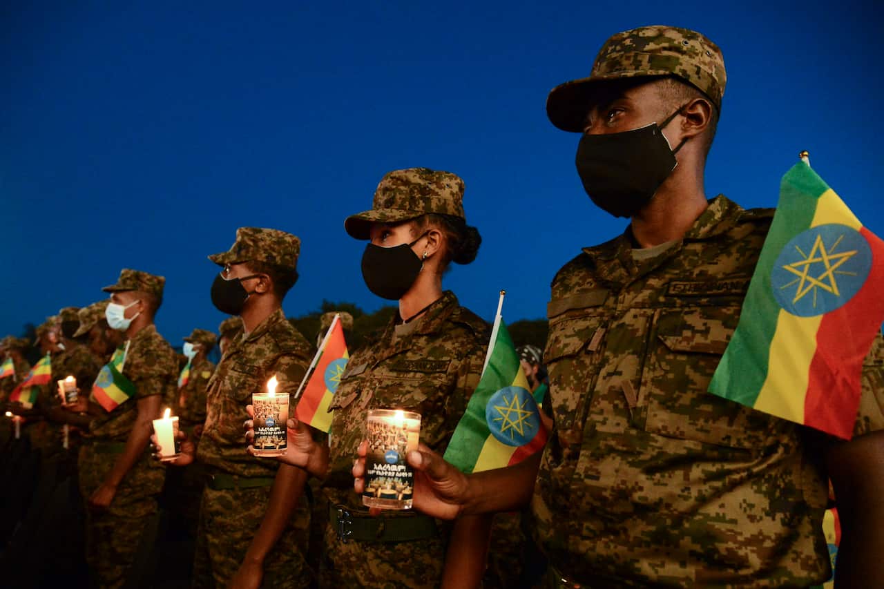 Ethiopian military personnel commemorate soldiers killed by forces loyal to the Tigray People's Liberation Front at the start of the conflict one year ago