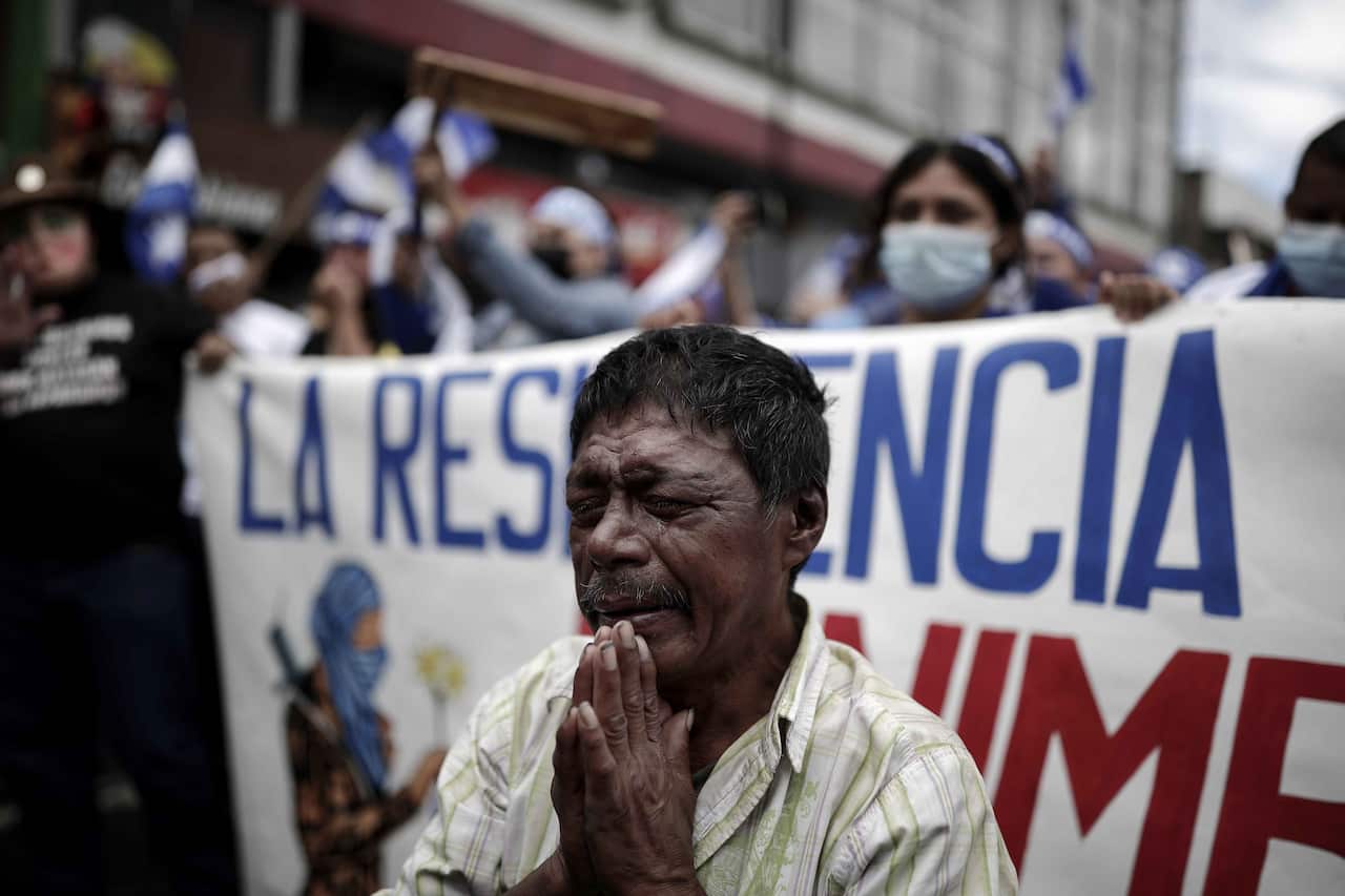 Exiled Nicaraguans protest through the main streets of San Jose, Costa Rica, against the presidential elections in their country of Nicaragua.
