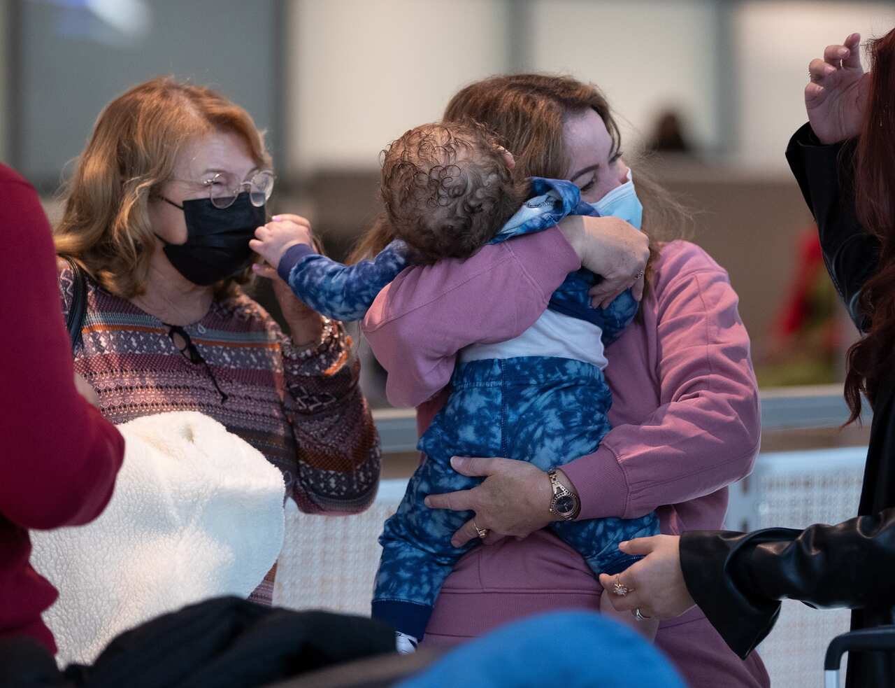 Hugs outside the US Customs and Border Protection gate at Boston's Logan International Airport