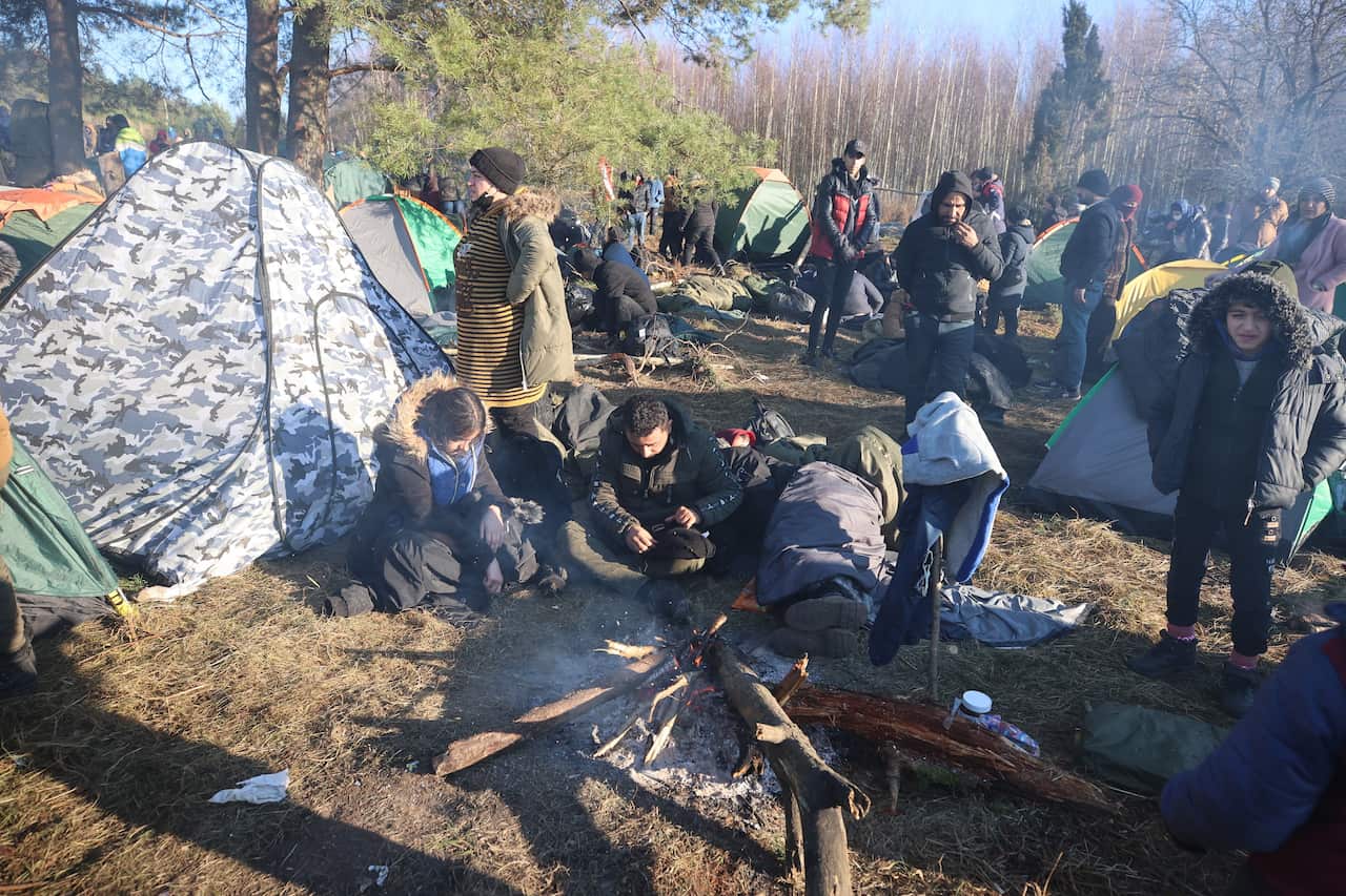 A handout picture shows migrants at their camp near the Belarus-Polish border in the Grodno region, Belarus