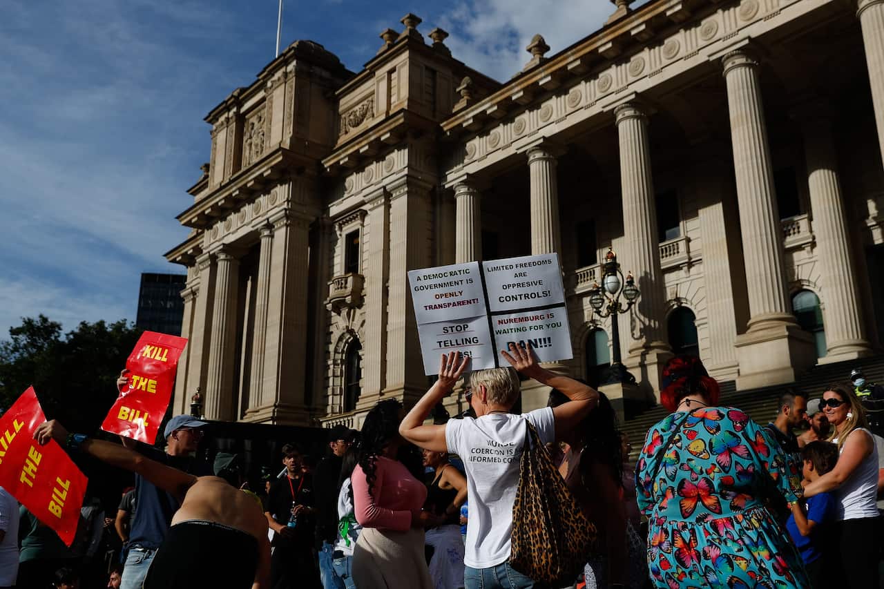 Protesters are seen during a demonstration outside the Victorian State Parliament, in Melbourne on 18 November, 2021. 
