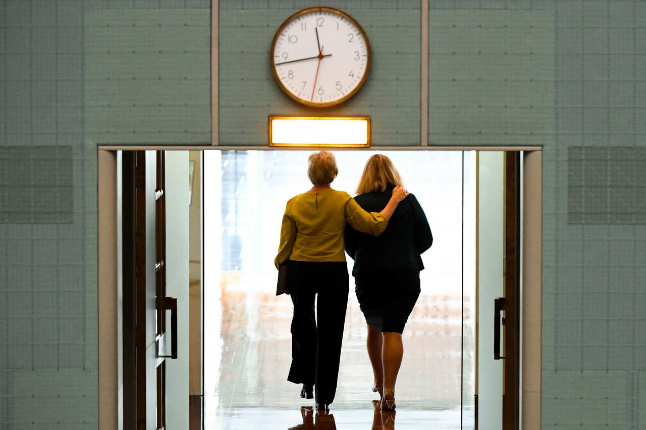 Independent MP Helen Haines and Liberal member for Bass Bridget Archer leave the chamber after crossing the floor during a division on allowing debate on an integrity commission