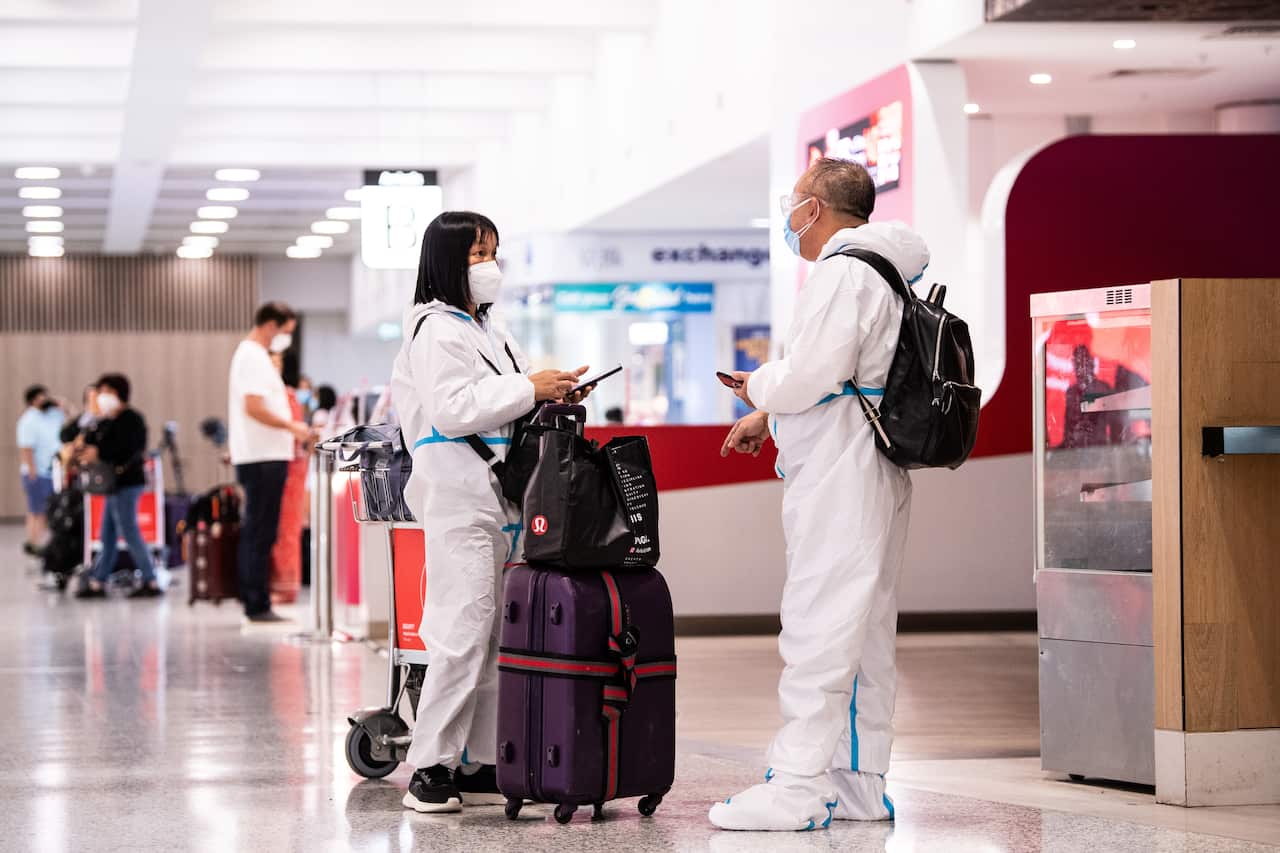 People wearing PPE at Sydney airport