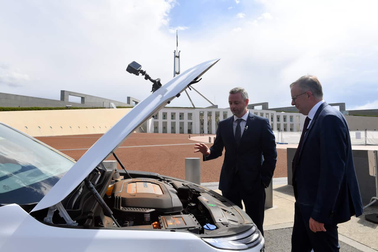Leader of the Opposition Anthony Albanese (R) after driving a Hyundai Nexo hydrogen powered vehicle past Parliament House in Canberra, Wednesday, December 1, 2021. (AAP Image/Mick Tsikas) NO ARCHIVING