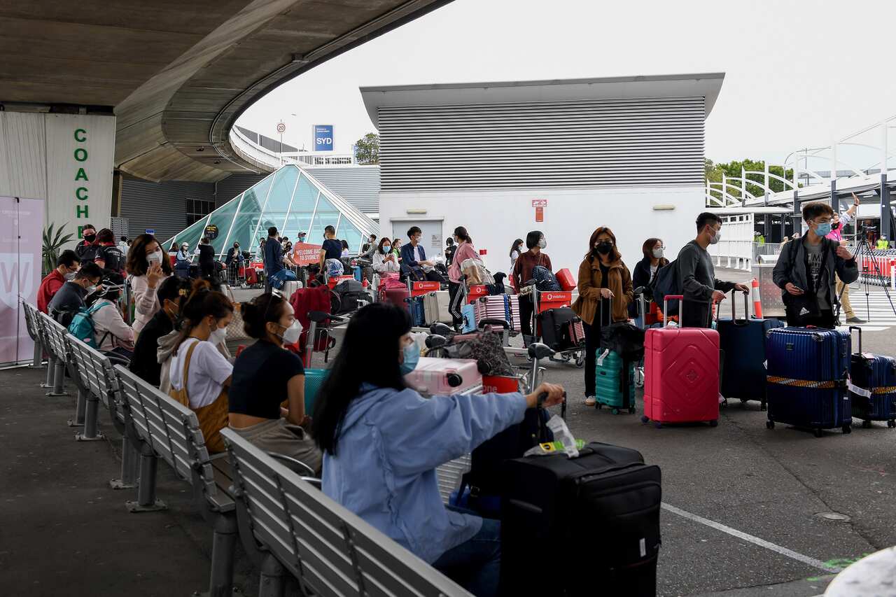 Picture of international students waiting for buses at Sydney airport after arriving in Australia,
