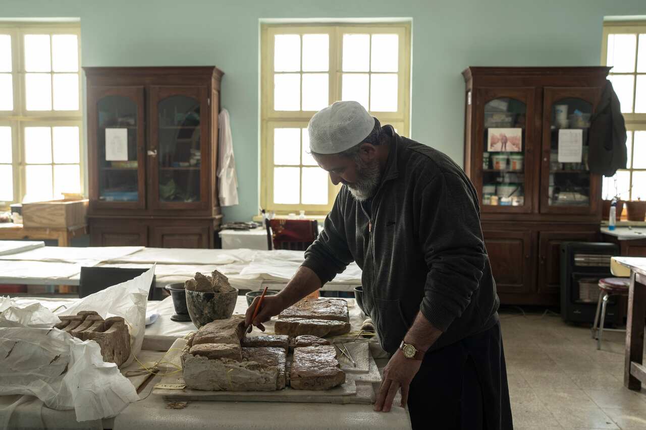 A conservator works at the National Museum of Afghanistan