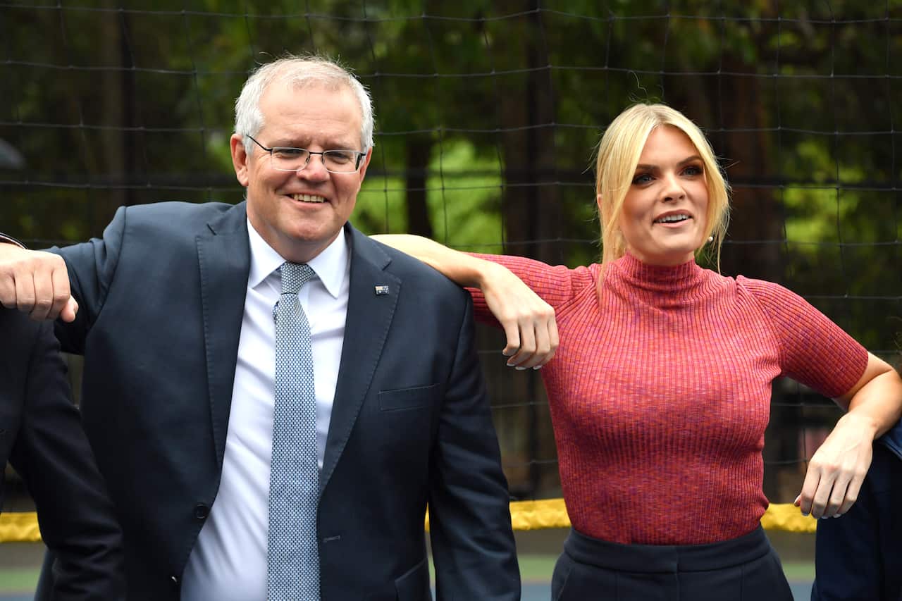 Television presenter Erin Molan and Prime Minister Scott Morrison at a press conference during a visit to Penshurst Girls School in Sydney, Wednesday, December 8, 2021. (AAP Image/Mick Tsikas) NO ARCHIVING