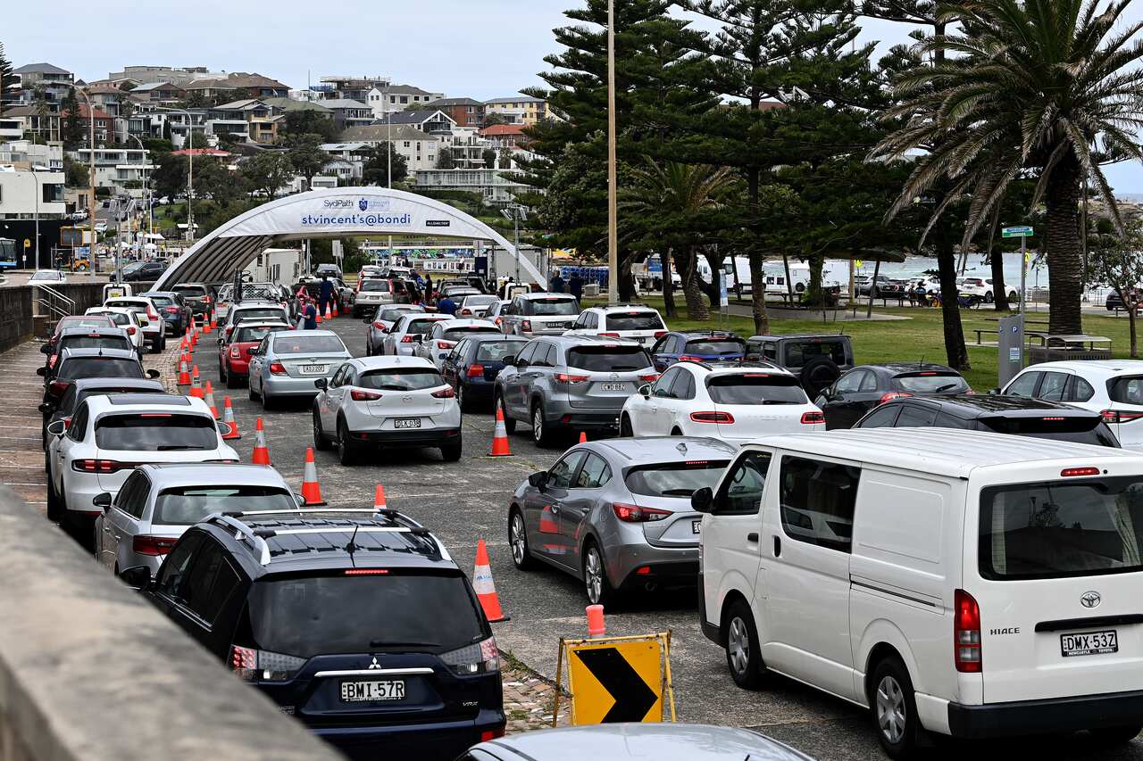 Cars lining up at the St Vincents Hospital drive-through testing clinic at Bondi Beach in Sydney, Friday, 17 December, 2021. 