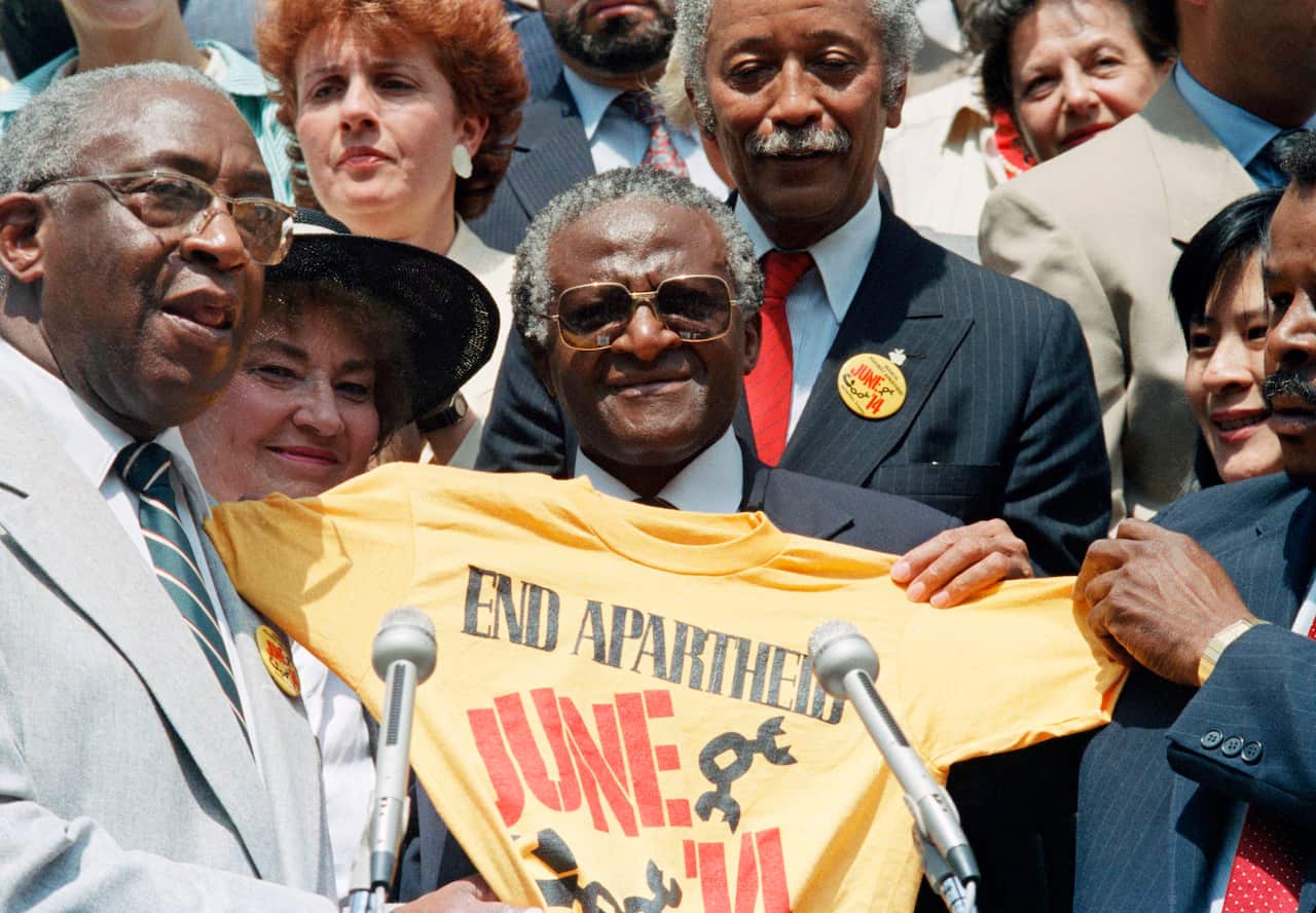 Desmond Tutu with an End Apartheid t-shirt