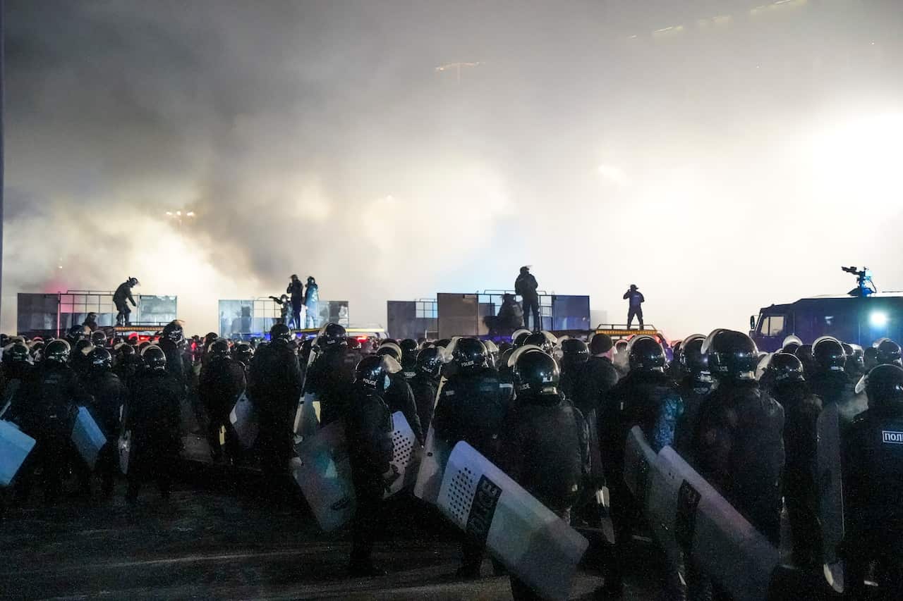 Riot police block protesters in the center of Almaty, Kazakhstan.