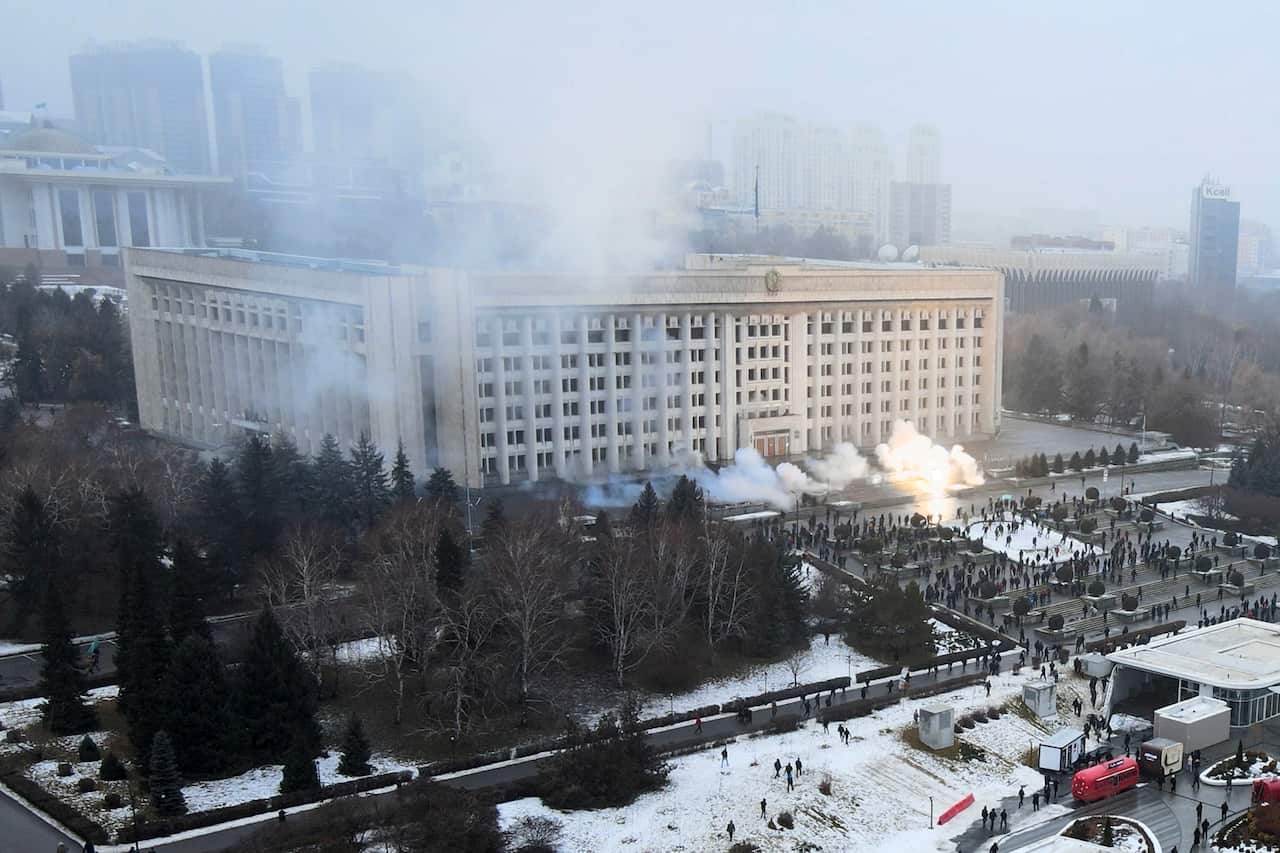 Smoke rises from the city hall building during a protest in Almaty, Kazakhstan, 5 January 2022. 