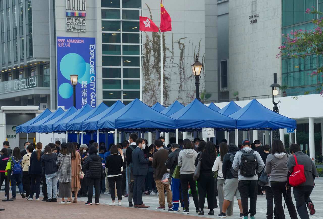 Residents line up at a temporary COVID-19 testing centre in Hong Kong.