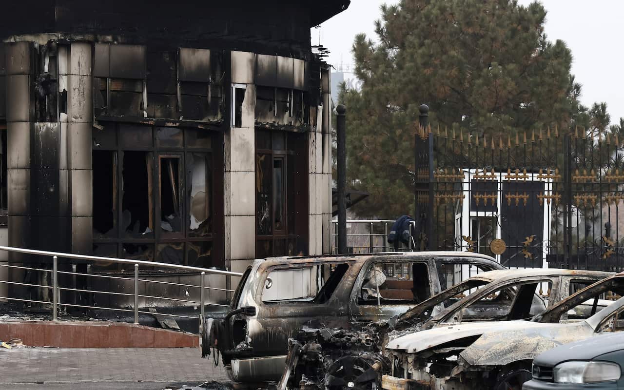 Burnt out vehicles outside the presidential residence