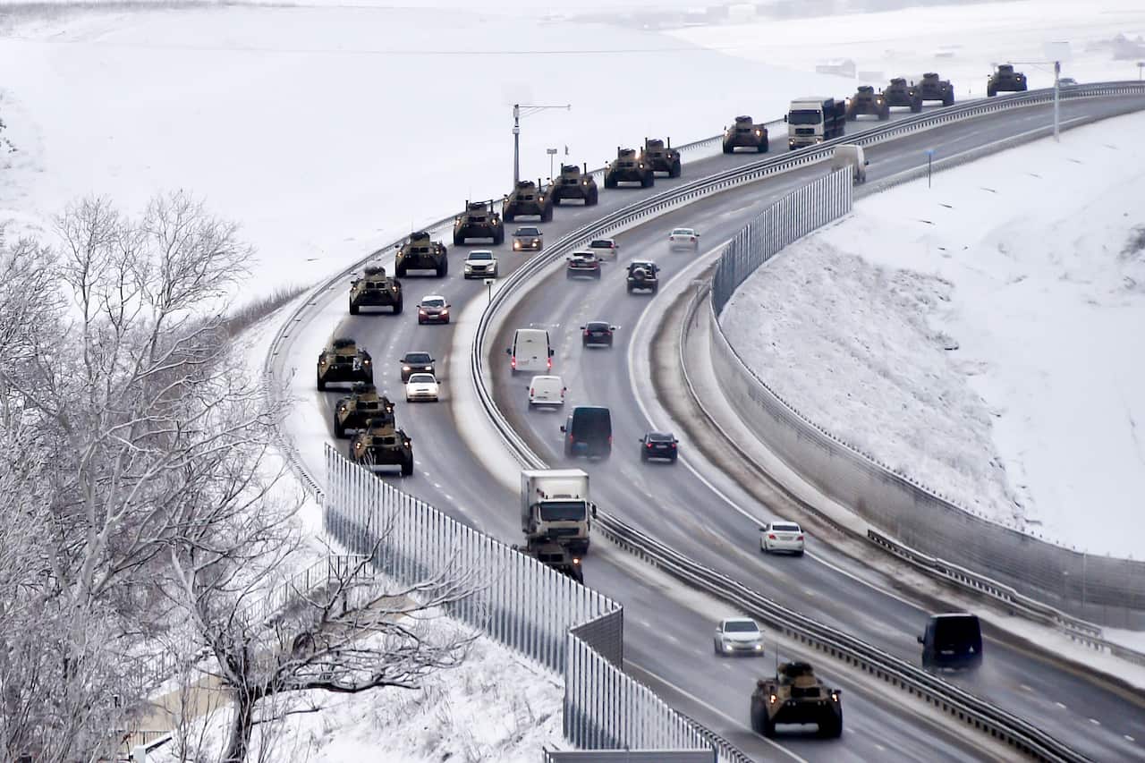 A convoy of Russian armoured vehicles moves along a highway in Crimea on 18 January 2022. 