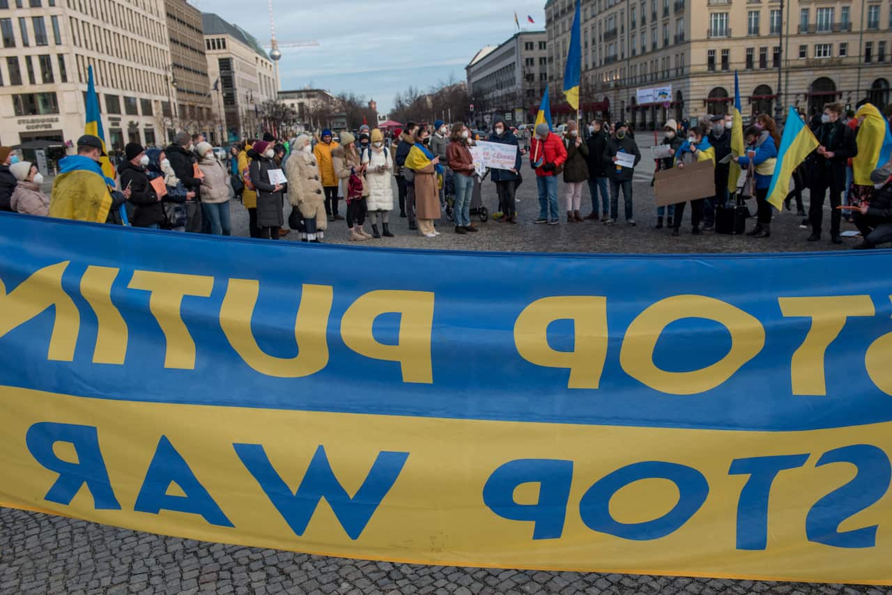 Several demonstrators gathered at an anti-Putin rally in front of the Brandenburg Gate in Berlin on January 22, 2022. (Photo by Jakub Podkowiak/PRESSCOV/Sipa USA)