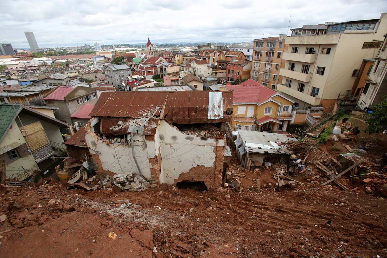 A destroyed house is covered by mud from a landslide caused by tropical storm Ana in Antananarivo, Madagascar.